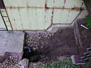 [thumbnail of what the buried plumbing and spliced in wall panels looked like after the main dirt excavation work.]